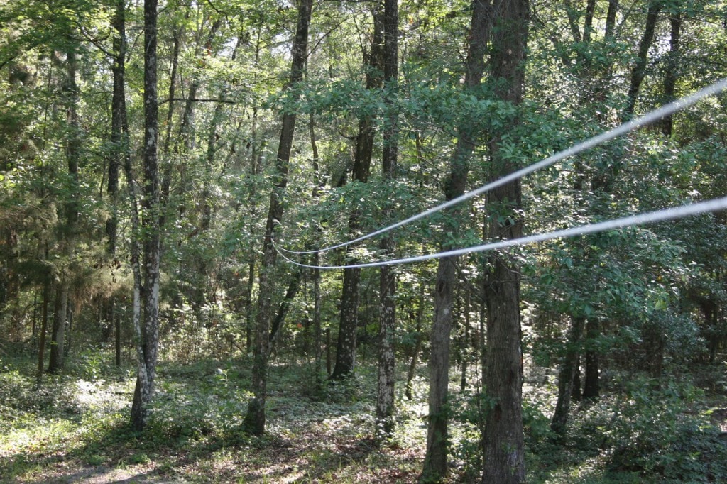 One end of the pulley clothesline should be anchored higher than the start of the clothesline, so clothes don't drag the ground.