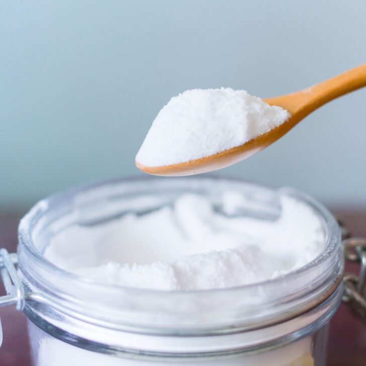 a spoonful of powder on a jar - homemade laundry powder without borax